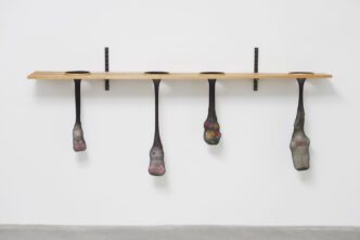 Nayland Blake, White Hares in Holes 1996, Nylon, wood, and plush toys, 35½ × 84 × 11¼ inches; 90 × 213 × 29 cm, © Nayland Blake, Courtesy the artist and Matthew Marks Gallery