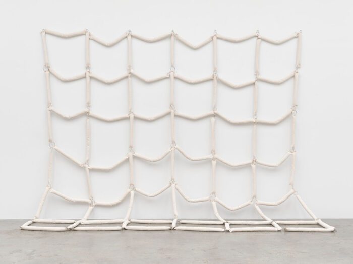 Howardena Pindell, Untitled 1971/2025, Canvas, enamel, grommets and foam, 365.8 x 365.8 cm | 144 x 144 in., © Howardena Pindell, Courtesy the artist and White Cube Gallery