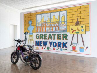 Left: fields harrington. Unfree Free Time (Bike Rental). 2026. E-bike and bike rack. Right: Cevallos Brothers. Greater New York. 2026 Acrylic on wall. Installation view of Greater New York, on view at MoMA PS1 from April 16 through August 17, 2026. Courtesy MoMA PS1. Photo: Kris Graves