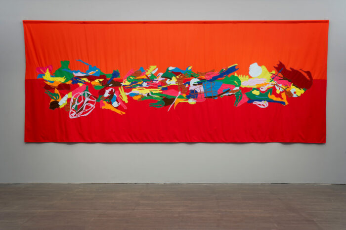 Francisca García & Mario Navarro, Tumba de arena (Sand Grave), 2026, textile in cotton, thread and felt, 696 x 290 cm, Installation view “Unearthed Conversation”, S.M.A.K. 2026. Photo Dirk Pauwels, © Francisca García & Mario Navarr, Courtesy the artists and S.M.A.K.