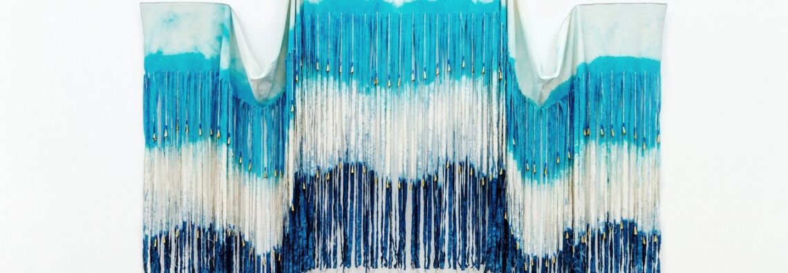 Chelsea Bighorn, Triple Point, 2025, canvas, dye, glass beads, artificial sinew, and jingle cones, 105 x 128 in. / 267 x 325 cm, © Chelsea Bighorn, Courtesy the artist and de boer Gallery