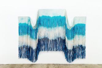 Chelsea Bighorn, Triple Point, 2025, canvas, dye, glass beads, artificial sinew, and jingle cones, 105 x 128 in. / 267 x 325 cm, © Chelsea Bighorn, Courtesy the artist and de boer Gallery