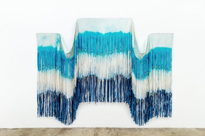Chelsea Bighorn, Triple Point, 2025, canvas, dye, glass beads, artificial sinew, and jingle cones, 105 x 128 in. / 267 x 325 cm, © Chelsea Bighorn, Courtesy the artist and de boer Gallery