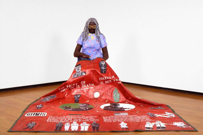Willie Birch, Memories of the '60s,1992. Painted papier-mâché, canvas, and mixed media, figure: 52 x 25 x 30 in; quilt: 94.5 x 81.5 in, Courtesy Willie Birch Studio; Photo: Sesthasak Booncha