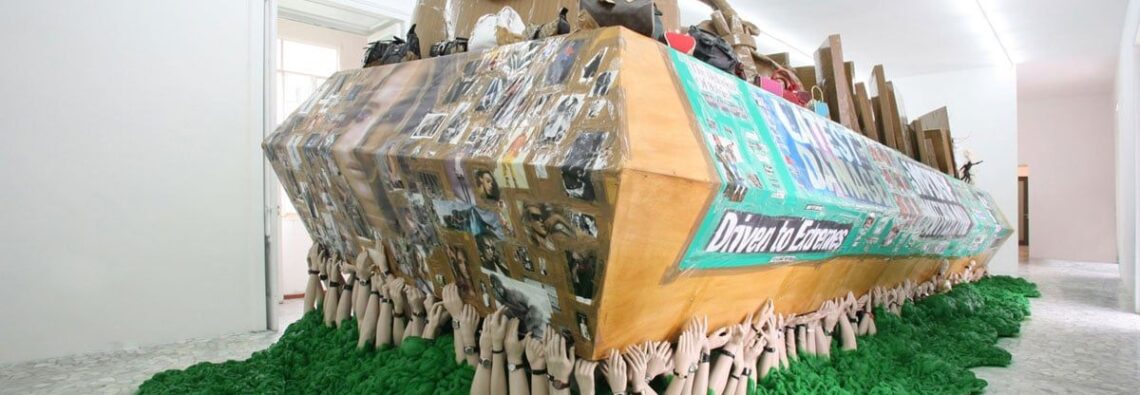 Thomas Hirschhorn, The Green Coffin, 2006, wood, spray paint, polystyrene, hands made of synthetic resin and ceramic, watches, tape, prints, cardboard, fabric, chess, chessboards, crustaceans made of plastic, sculptures, photocopies, handbags, 359 x 112.9 x 436 cm, © Thomas Hirschhorn, Courtesy the artist and Alfonso Artiaco  Gallery